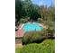 Large community pool surrounded by lounge chairs, perfect for summer relaxation and recreation at 160 Wing Mill Rd, Sandy Springs, GA 30350