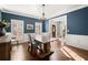 Well-appointed dining room with natural light and a doorway view of the home's entrance at 160 Wing Mill Rd, Sandy Springs, GA 30350