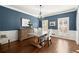 Elegant dining room featuring hardwood floors, wainscoting, and natural light at 160 Wing Mill Rd, Sandy Springs, GA 30350