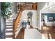 Inviting foyer with hardwood floors, staircase, and views into the formal rooms at 160 Wing Mill Rd, Sandy Springs, GA 30350