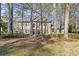 Traditional red brick home with a manicured lawn and mature trees, offering classic curb appeal at 160 Wing Mill Rd, Sandy Springs, GA 30350