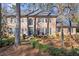 A beautiful, two-story brick home with manicured landscaping creates a welcoming curb appeal at 160 Wing Mill Rd, Sandy Springs, GA 30350