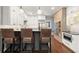 Beautiful kitchen with white cabinets, stainless steel appliances, and a brick accent wall at 160 Wing Mill Rd, Sandy Springs, GA 30350
