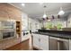 Spacious kitchen featuring stainless steel appliances, hardwood floors and a breakfast bar at 160 Wing Mill Rd, Sandy Springs, GA 30350