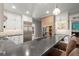 Contemporary kitchen featuring stainless steel appliances, white cabinets, and a stylish island with seating at 160 Wing Mill Rd, Sandy Springs, GA 30350