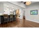Kitchen with breakfast bar, stainless steel appliances, hardwood floors and brick oven surround at 160 Wing Mill Rd, Sandy Springs, GA 30350