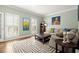 Bright living room with shuttered windows, hardwood floors, and stylish decor at 160 Wing Mill Rd, Sandy Springs, GA 30350