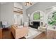Open living room boasts a high ceiling, fireplace, and stylish seating arrangement at 160 Wing Mill Rd, Sandy Springs, GA 30350