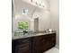 Main bathroom with granite countertops, modern fixtures, and a vanity mirror at 160 Wing Mill Rd, Sandy Springs, GA 30350