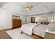 Relaxing main bedroom showcasing a wooden dresser, hardwood floors, and an attached office area at 160 Wing Mill Rd, Sandy Springs, GA 30350
