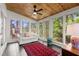 Cozy sunroom featuring wood ceilings, lots of windows, and an inviting sitting area at 160 Wing Mill Rd, Sandy Springs, GA 30350