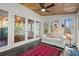 Bright sunroom with wood ceiling, many windows, and glass doors to allow for lots of light at 160 Wing Mill Rd, Sandy Springs, GA 30350