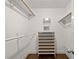 Walk-in closet with built-in shelving and wood floors at 160 Wing Mill Rd, Sandy Springs, GA 30350