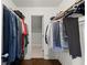 Spacious walk-in closet with hanging racks and ample storage space at 160 Wing Mill Rd, Sandy Springs, GA 30350