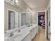 Spacious bathroom featuring double sinks, modern fixtures, and ample counter space at 1811 Mcconnell Rd, Grayson, GA 30017