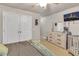 Cozy bedroom featuring a comfortable bed, dresser, and large closet at 1811 Mcconnell Rd, Grayson, GA 30017