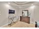 Bedroom featuring neutral colors, carpet flooring, dresser, and mounted TV at 1811 Mcconnell Rd, Grayson, GA 30017
