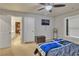 Bedroom featuring a comfortable bed, ceiling fan, and mounted TV at 1811 Mcconnell Rd, Grayson, GA 30017