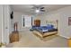 Bedroom featuring a comfortable bed, ceiling fan, and large window at 1811 Mcconnell Rd, Grayson, GA 30017