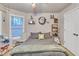 Well-lit bedroom featuring stylish decor, a comfortable bed, and ample natural light at 1811 Mcconnell Rd, Grayson, GA 30017