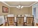 Elegant dining room with stylish chairs, chandelier, and ample natural light at 1811 Mcconnell Rd, Grayson, GA 30017