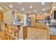 Bright kitchen with wood cabinets, granite countertops, stainless steel appliances, and hardwood floors at 1811 Mcconnell Rd, Grayson, GA 30017