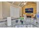 Granite countertop with sink and faucet; open concept living room featuring vaulted ceilings in background at 1811 Mcconnell Rd, Grayson, GA 30017