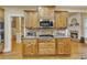Spacious kitchen with stainless steel appliances, granite countertops, and seamless flow to the living area at 1811 Mcconnell Rd, Grayson, GA 30017
