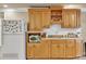 Bright kitchen featuring light wood cabinets, white subway tile backsplash, and stainless steel appliances at 1811 Mcconnell Rd, Grayson, GA 30017