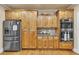 Elegant kitchen featuring stainless steel appliances and an abundance of wooden cabinetry for storage at 1811 Mcconnell Rd, Grayson, GA 30017