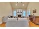 Cozy living room featuring a fireplace, hardwood floors, and ample natural light at 1811 Mcconnell Rd, Grayson, GA 30017