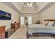 Large main bedroom with neutral walls, television, and carpet floors at 1811 Mcconnell Rd, Grayson, GA 30017