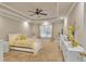 Spacious main bedroom with trey ceilings, a ceiling fan, carpet, and bright natural lighting at 1811 Mcconnell Rd, Grayson, GA 30017