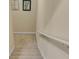 View of the beige stairway with decorative art hanging on the painted walls at 1811 Mcconnell Rd, Grayson, GA 30017