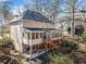 Exterior of two-story home showing the multi-level deck, patio, and backyard at 217 Colonial Dr, Woodstock, GA 30189