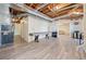 Spacious unfinished basement with laminate flooring, painted walls, and an open ceiling at 217 Colonial Dr, Woodstock, GA 30189