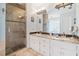 Modern bathroom featuring a walk-in shower and granite countertops at 217 Colonial Dr, Woodstock, GA 30189