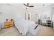 Bright bedroom with light walls, ceiling fan, and vanity desk area at 217 Colonial Dr, Woodstock, GA 30189