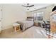 Bright bedroom features neutral colors, fan, a closet, and natural light at 217 Colonial Dr, Woodstock, GA 30189