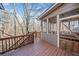 Spacious outdoor deck with views of the surrounding woods at 217 Colonial Dr, Woodstock, GA 30189