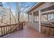Spacious outdoor deck overlooking private backyard and surrounding woods at 217 Colonial Dr, Woodstock, GA 30189