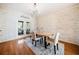 Bright dining room featuring wooden walls and a modern chandelier at 217 Colonial Dr, Woodstock, GA 30189