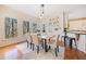 Inviting dining area with natural light, offering a seamless flow to outdoor views and the adjacent kitchen space at 217 Colonial Dr, Woodstock, GA 30189