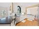 Gourmet kitchen with white cabinets, stainless steel appliances and a sunny view, perfect for cooking and entertaining at 217 Colonial Dr, Woodstock, GA 30189
