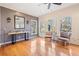 Cozy living room with hardwood floors, large windows, and comfortable seating at 217 Colonial Dr, Woodstock, GA 30189