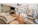 Spacious living room featuring a stone fireplace, built-in shelving, and hardwood flooring at 217 Colonial Dr, Woodstock, GA 30189