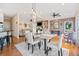 Open floor plan with a dining area, living room, and kitchen all flowing seamlessly together at 217 Colonial Dr, Woodstock, GA 30189