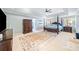 Spacious main bedroom features a tray ceiling, ceiling fan, and sitting area at 217 Colonial Dr, Woodstock, GA 30189