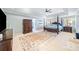 Spacious main bedroom with tray ceiling, sitting area, and walk-in closet at 217 Colonial Dr, Woodstock, GA 30189