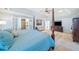 Bright main bedroom with four poster bed and access to bathroom with glass shower at 217 Colonial Dr, Woodstock, GA 30189